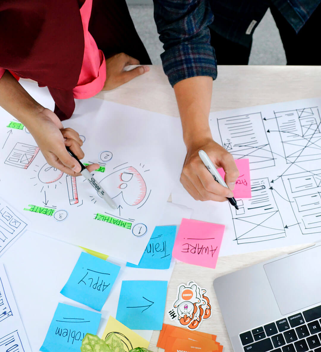 wo people working on wireframes